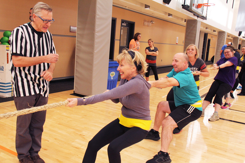 CWB National Leasing President & CEO Michael Dubowec referees a tug-of-war match at a team-building event during the company’s annual Sales Conference