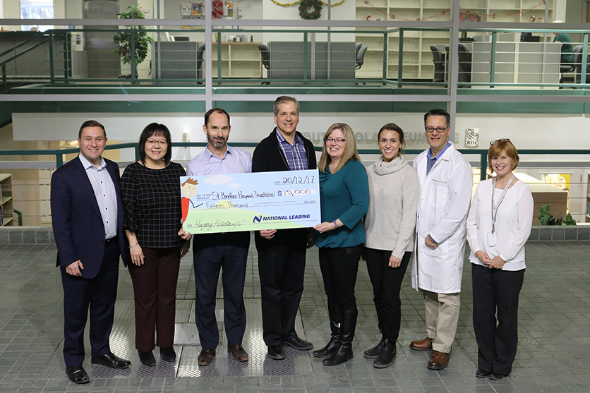 CWB National Leasing employees visit the Albrechtsen Research Centre to see the impact of CWB National Leasing's $15,000 donation. 