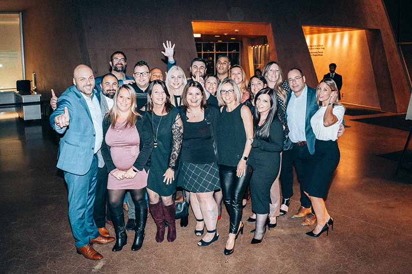 Team Teal celebrates the company’s 2022 gala