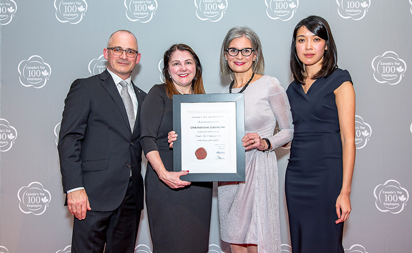 Wendy Guilbault and Laine Jubinville accept Canada’s Top 100 Employers award on behalf of CWB National Leasing