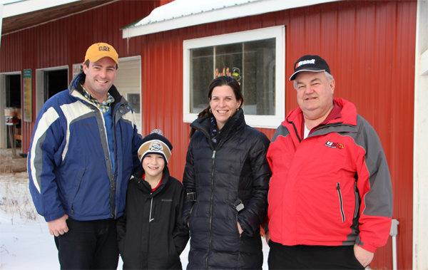 Garth Myers with his family and CWB National Leasing Account Manager Becky Howard