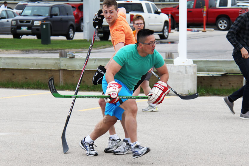 Bernie Young (front) playing in CWB National Leasing’s ball hockey league
