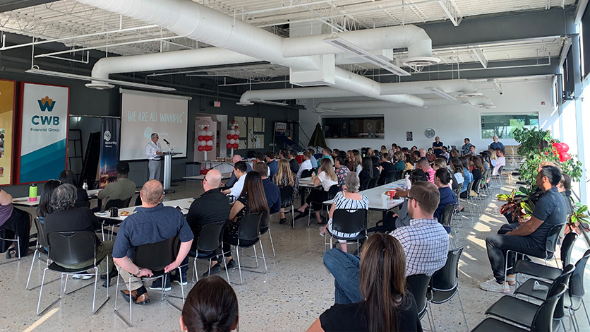 CWB National Leasing employees listen to the United Way Impact Speaker during a Lunch and Learn