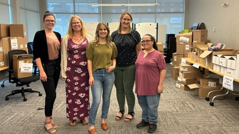 A few employees gather for a picture while they take time to volunteer at a United Way agency