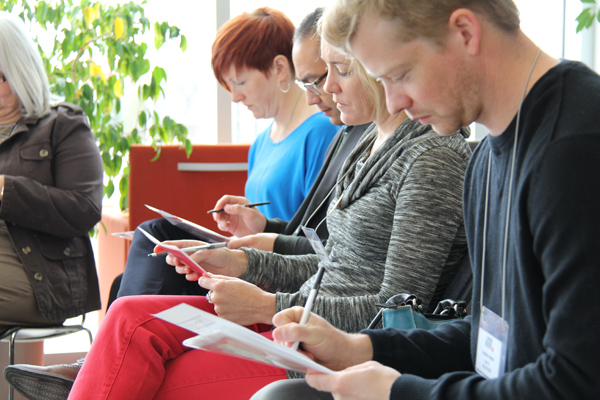 Participants take part in United Way Poverty Simulation at CWB National Leasing head office