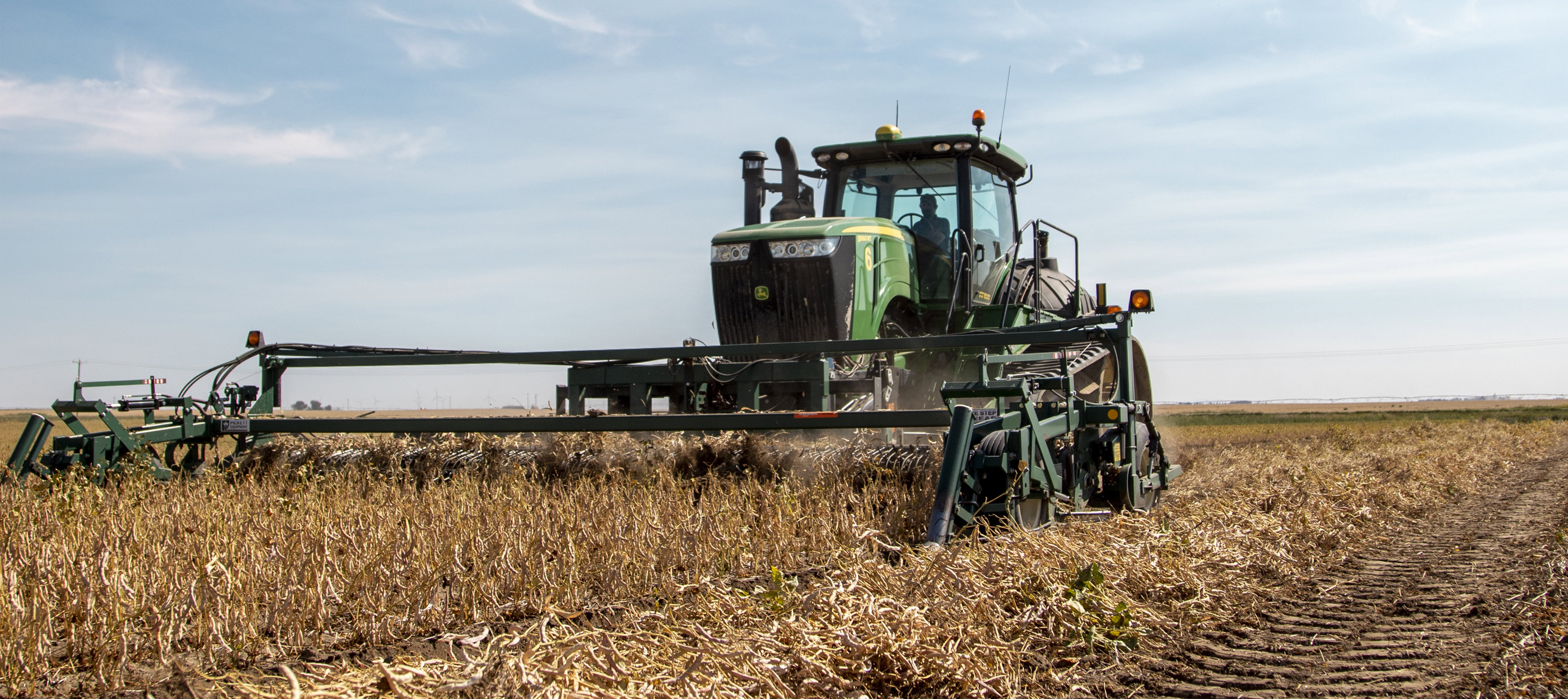 Agriculture tractor in a wheat field