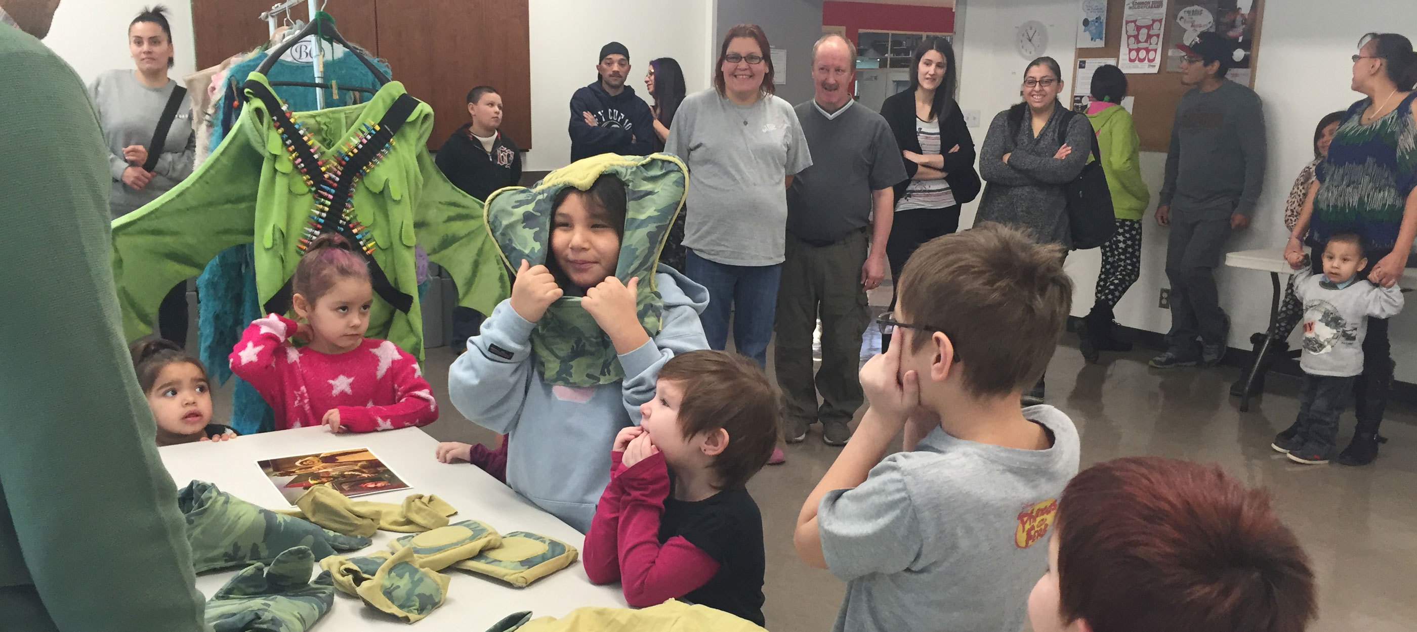 A group of happy chidren enjoying a play at Winnipeg's Prairie Theatre Exchange