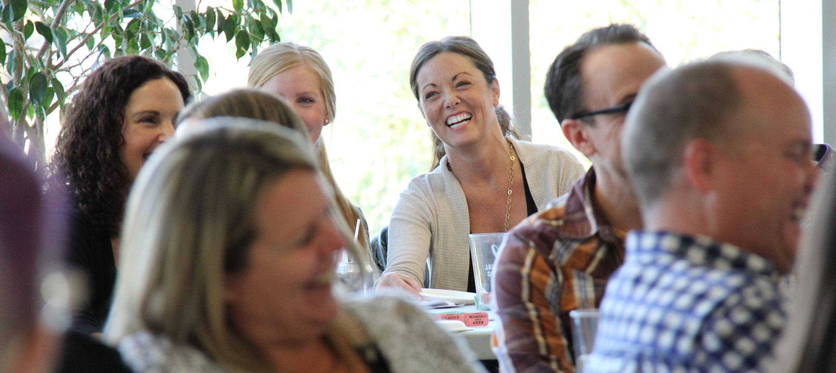 CWB National Leasing employees laughing at a staff meeting