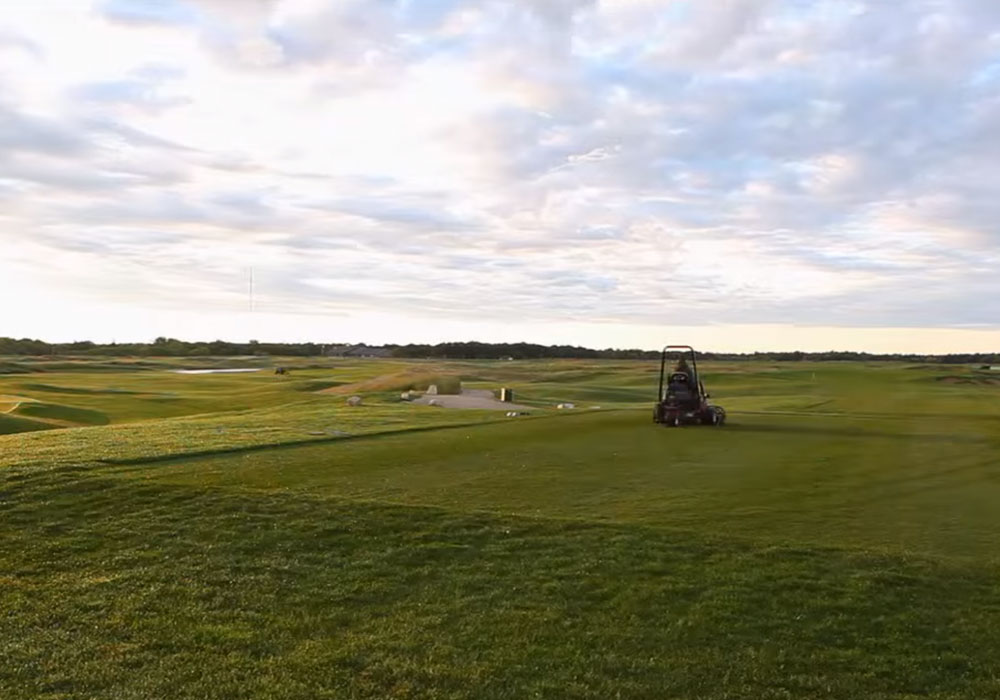 A photo of riding lawn mower tending one of Southwood Golf and Country Club's 18 holes